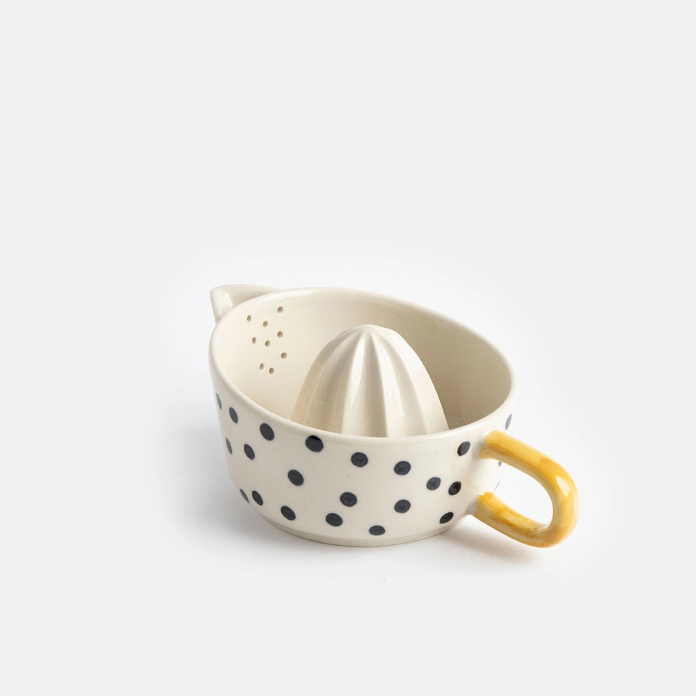 Mono Dots citrus juicer in hand-painted glazed stoneware, yellow handle
