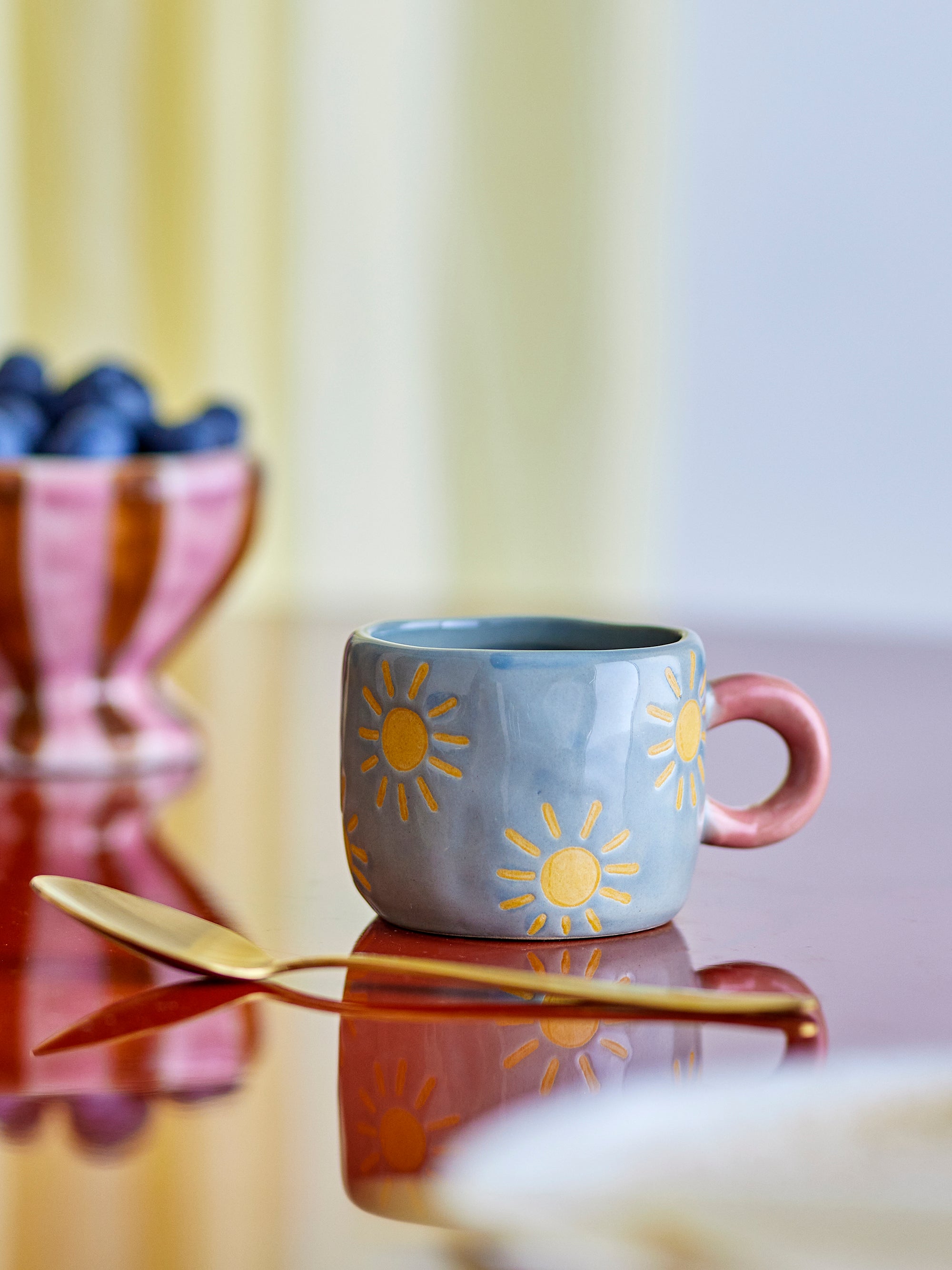Nini blue stoneware mug with yellow suns