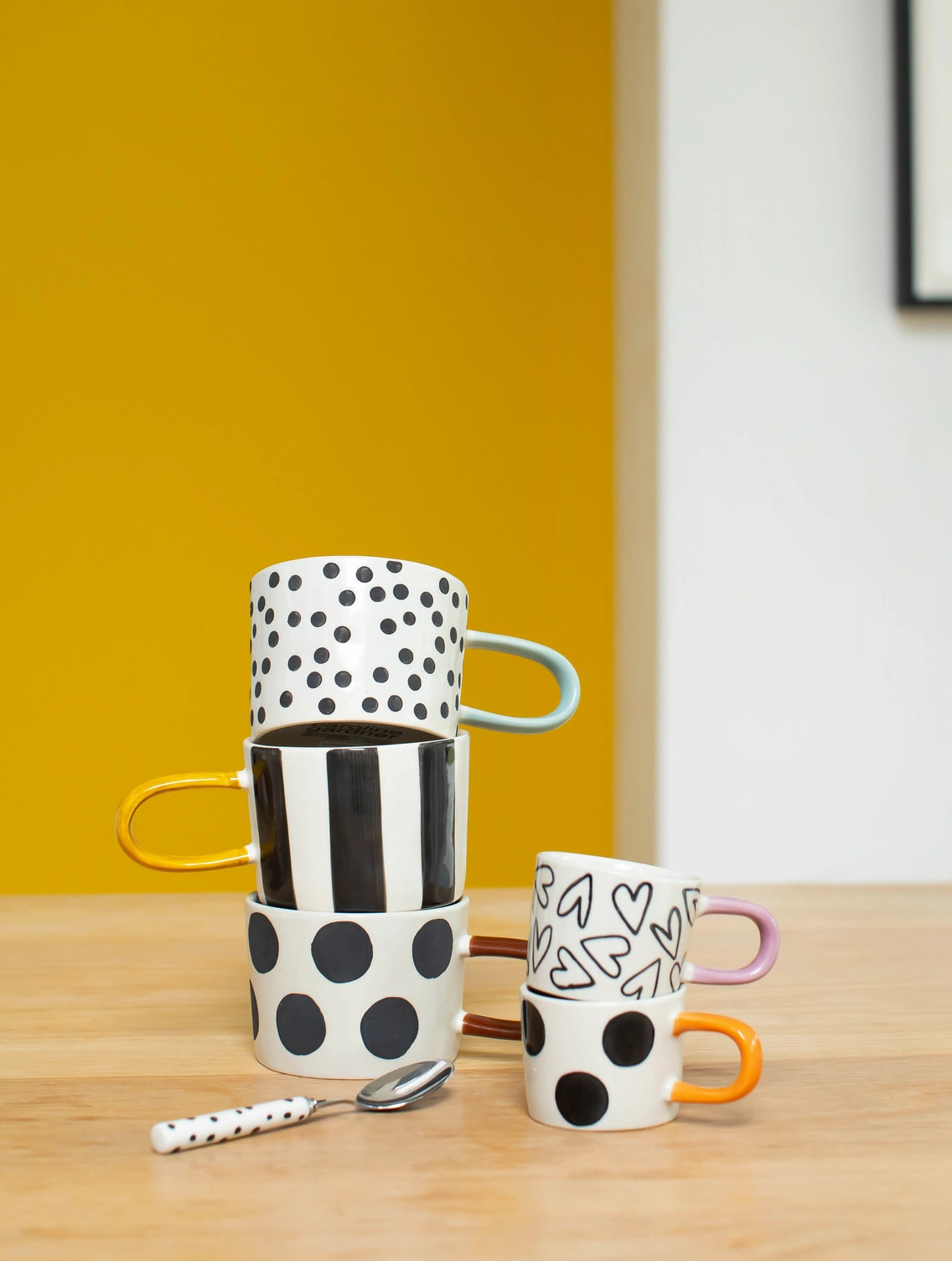 Mono mug with wide black stripes in hand-painted glazed stoneware